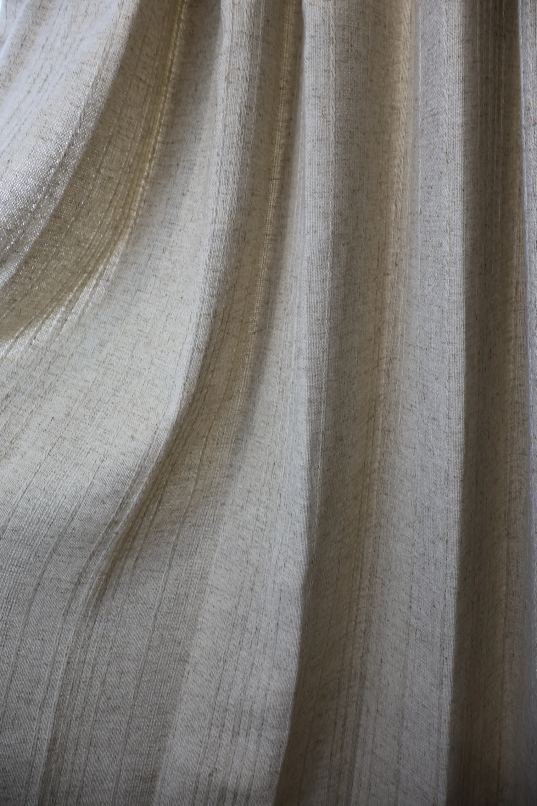 Soft silver curtain fabric with a smooth drape