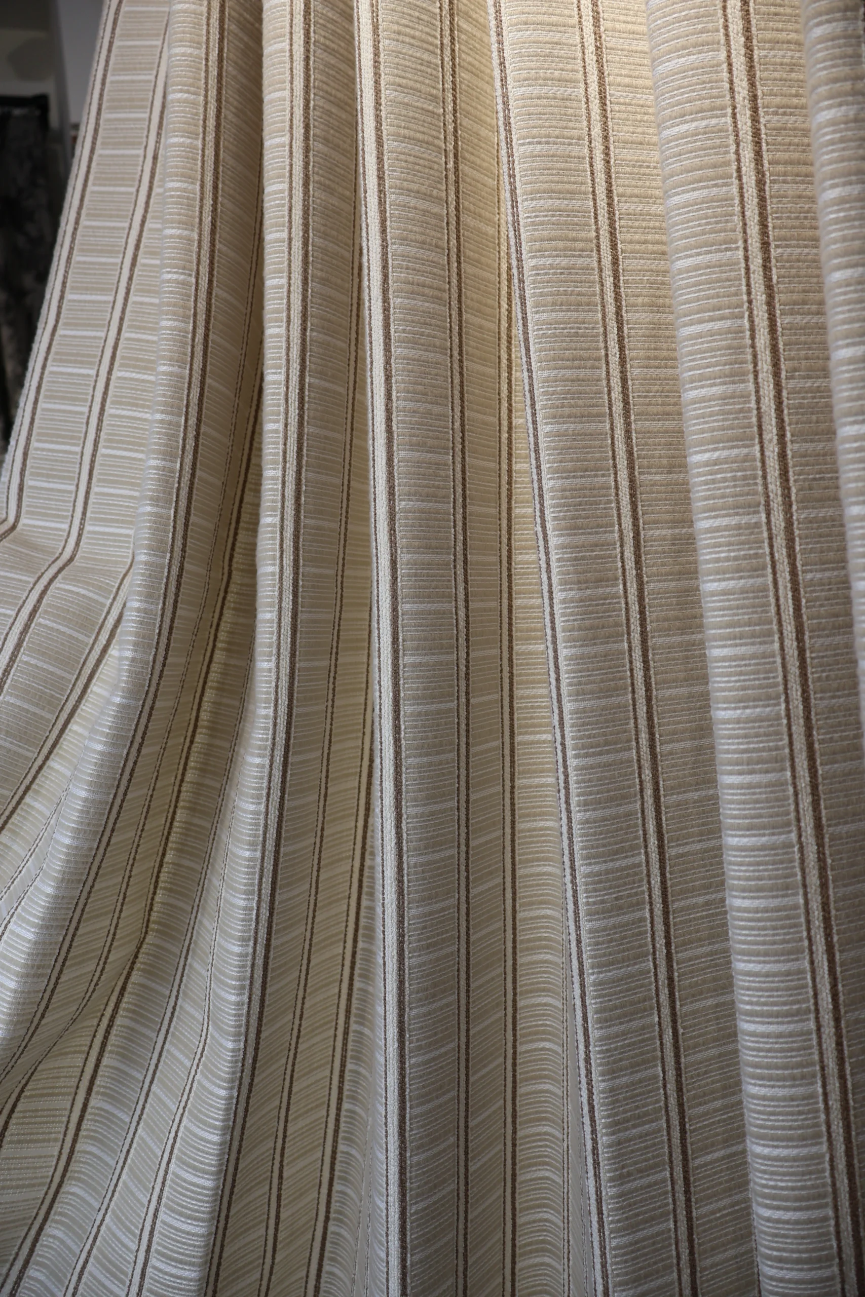 Warm woven curtain fabric in vertical folds