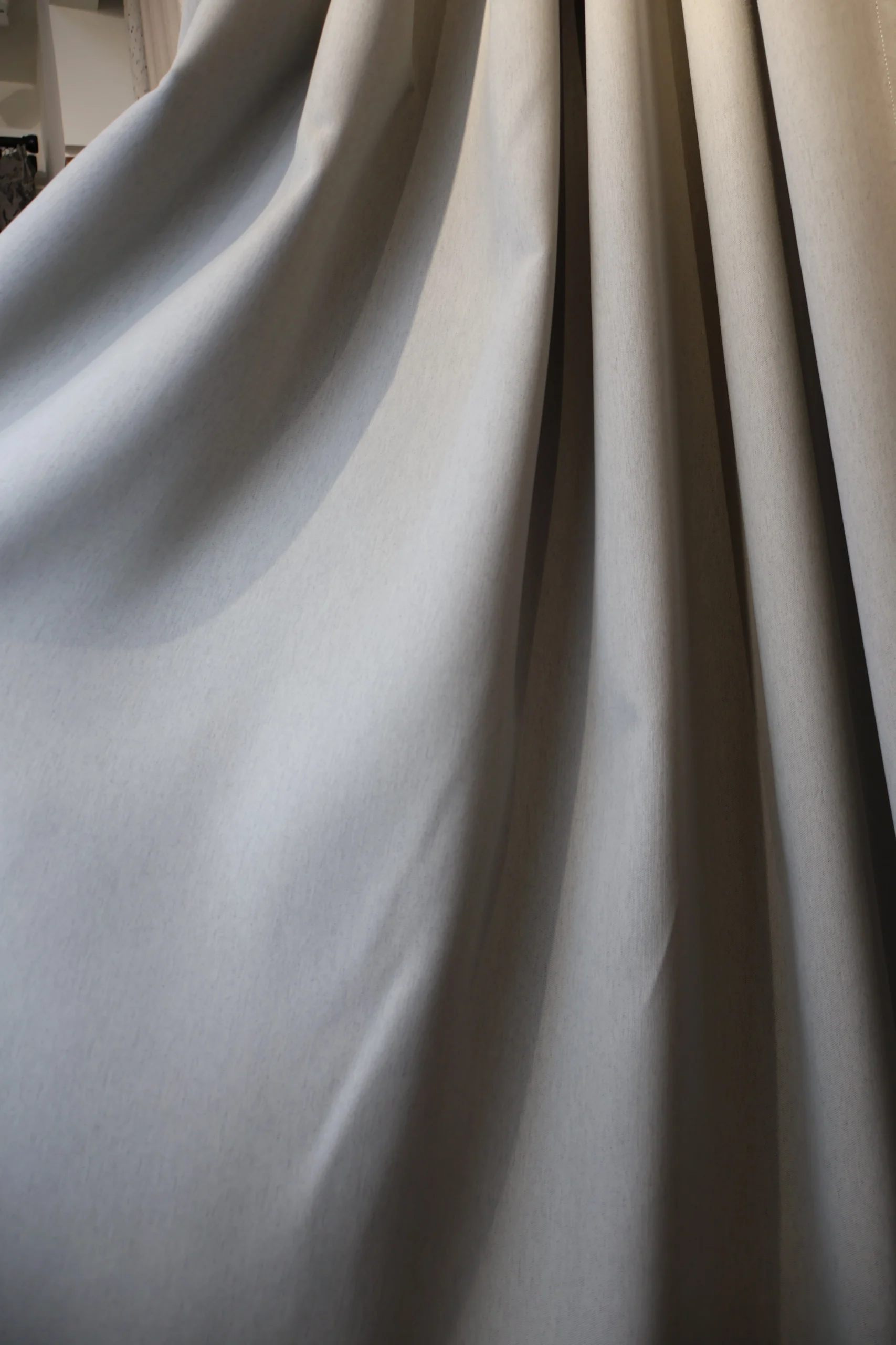 Smooth light grey curtain fabric